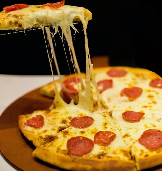Pepperoni pizza with mozzarella strings